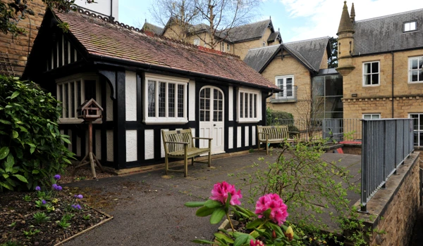 A bright outdoor area surrounded by flowers