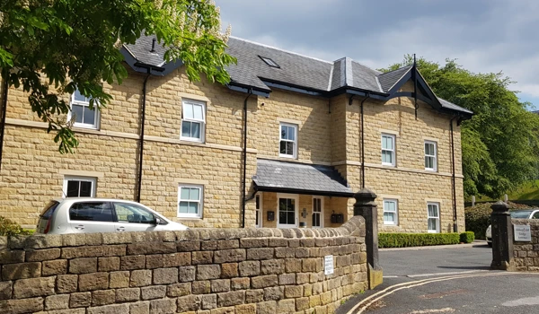 Front view of Abbeyfield House, a beautiful built stone house in Ikley, West Yorkshire